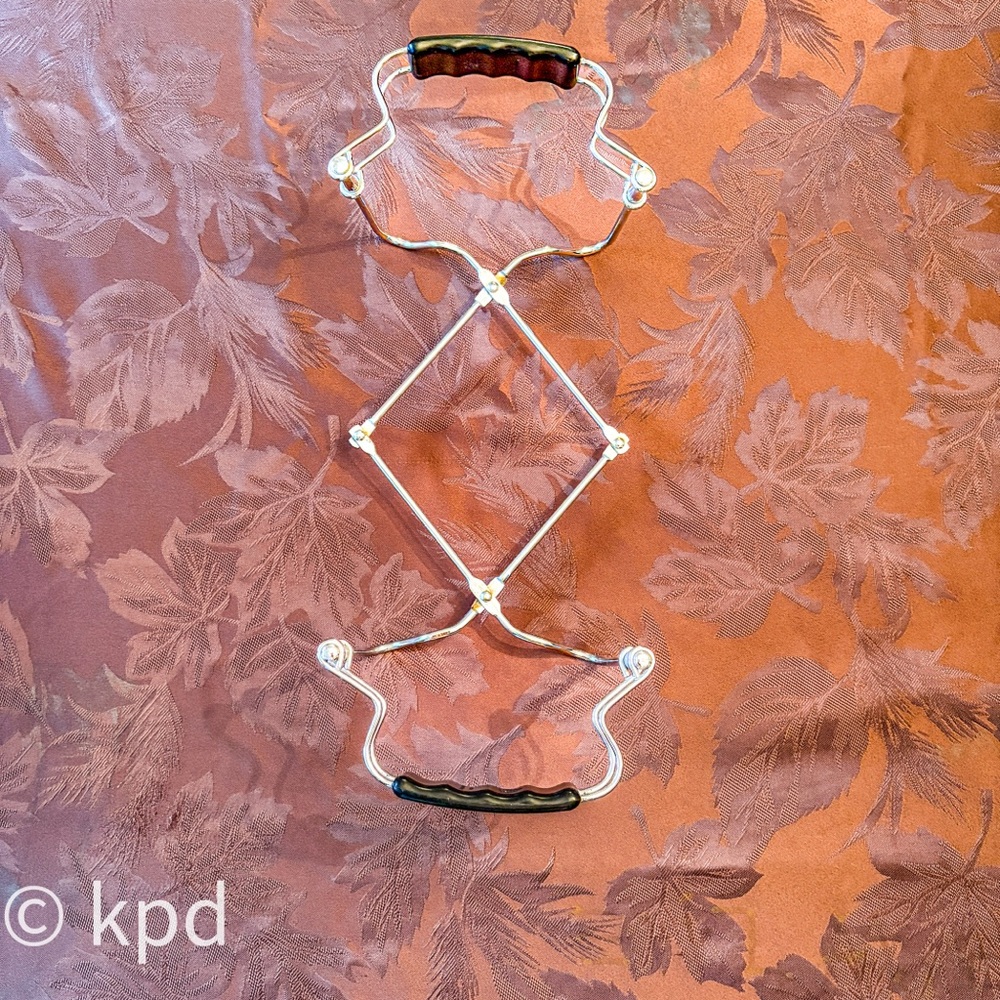 Chrome Expandable Pyrex Carrier with Black Handles – Mid-Century Bakeware Stand